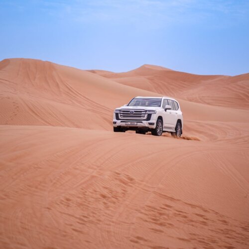 White Toyota Land Cruiser 4x4 on the desert dunes during a jeep safari from Hurghada