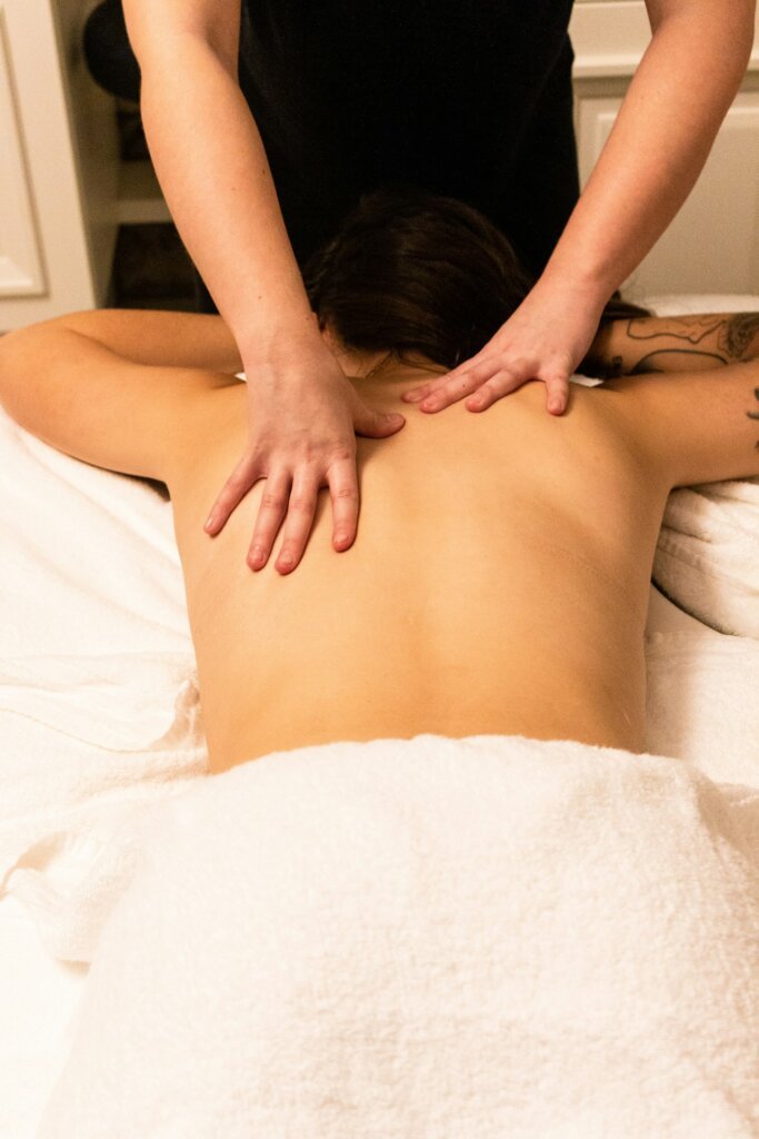 A woman getting a relaxing back massage at a spa